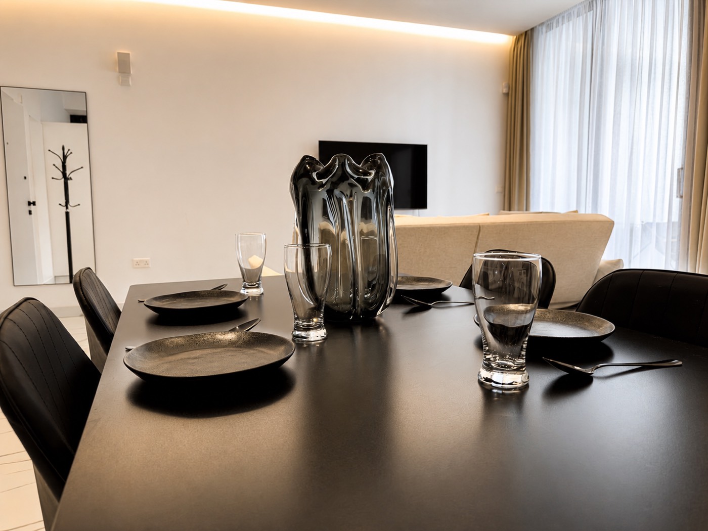 Dining table set for a meal, usable as a work desk